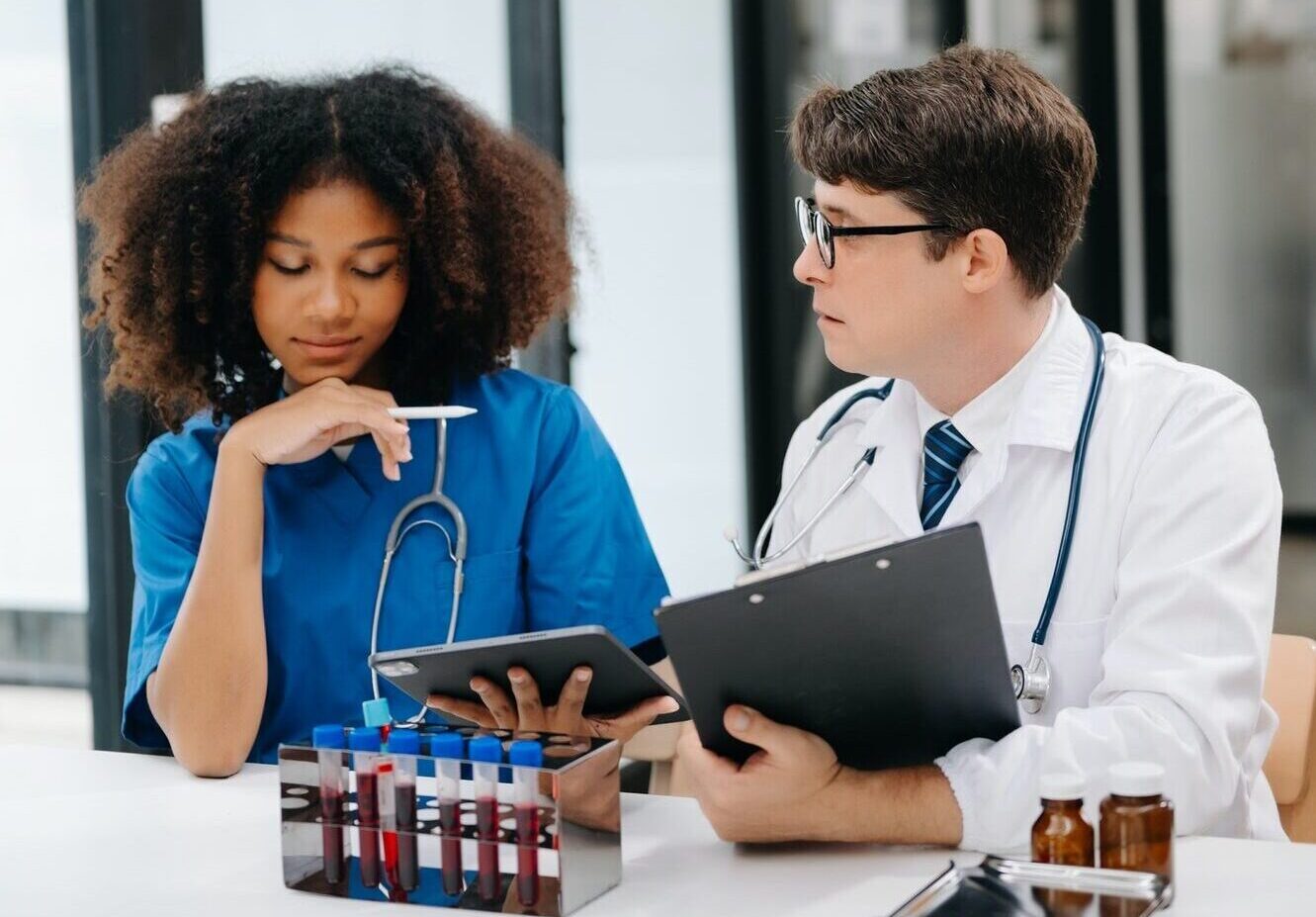 Scientist with tablet and laptop, laboratory and ecofriendly science. Agriculture, research